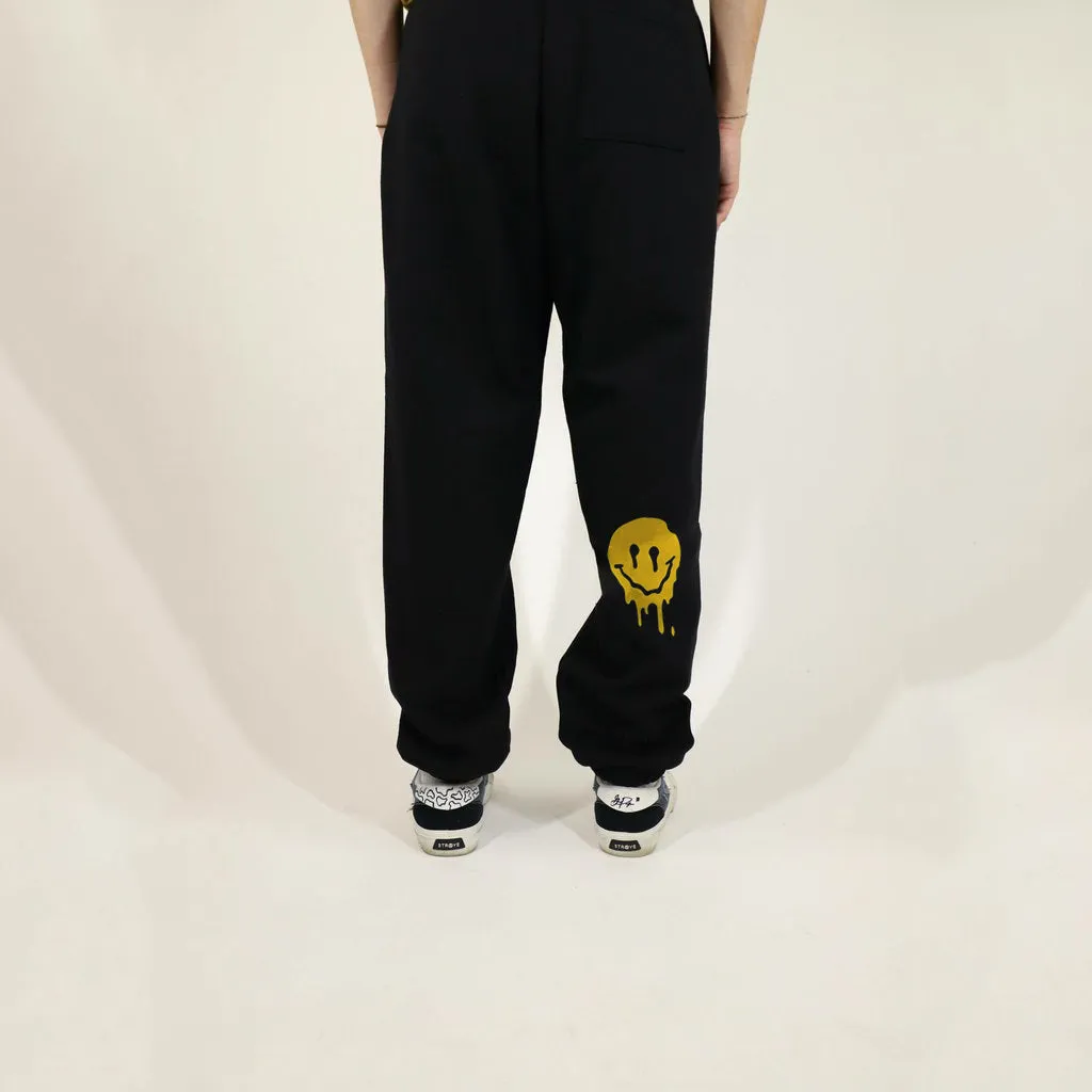 Street casual style melted smiley printed trousers